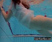 Sexy redhead in the white dress from underwater flash